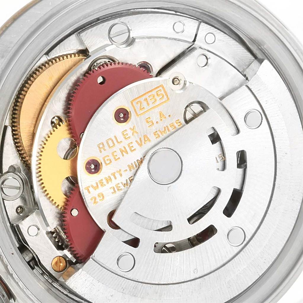 The image shows the movement mechanism of a Rolex Datejust 69173 Women's Steel and Gold (two tone) Blue Dial 69173 Women's Steel and Gold (two tone) Blue Dial watch, focusing on gears and the rotor assembly.