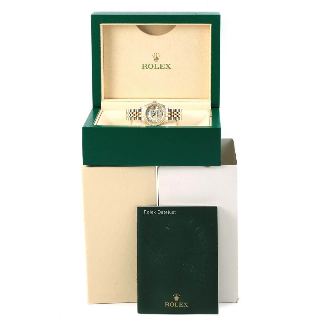The image shows a Rolex Datejust 179383 Women's Steel and Gold (two tone) Mother of Pearl Dial 179383 Women's Steel and Gold (two tone) Mother of Pearl Dial watch in its case, atop its packaging, with an accompanying booklet.