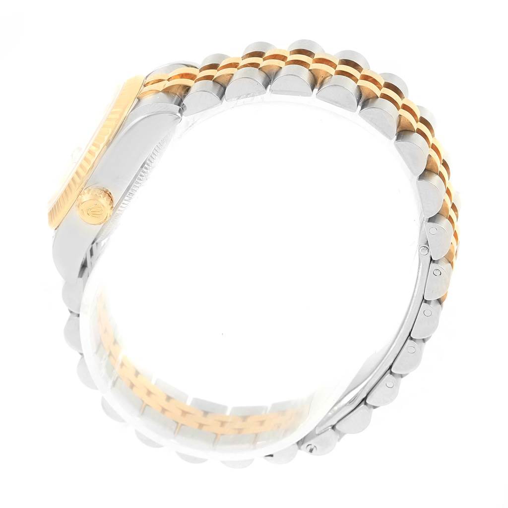 This image shows a side view of the Rolex Datejust 179173 Women's Steel and Gold (two tone) Silver Dial 179173 Women's Steel and Gold (two tone) Silver Dial watch, focusing on the two-tone bracelet and the crown.