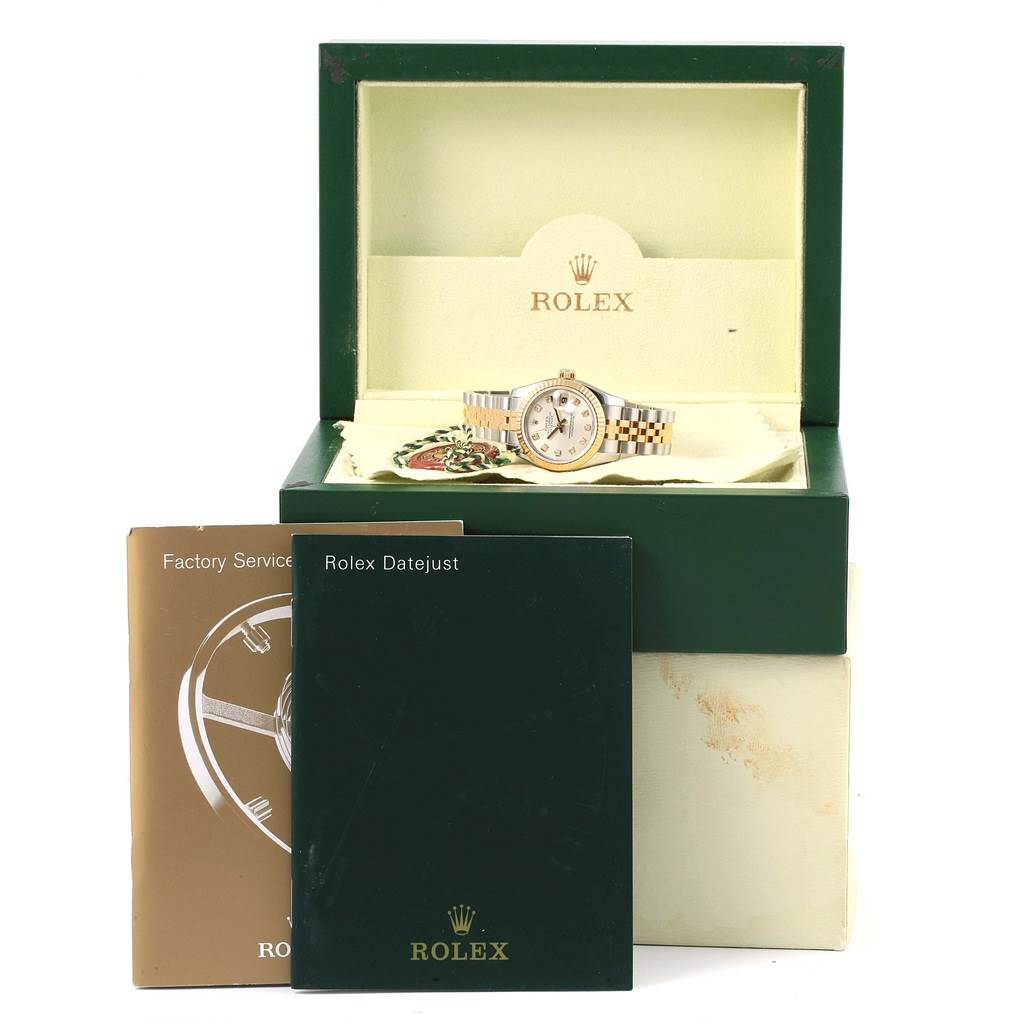 The image shows a Rolex Datejust 179173 Women's Steel and Gold (two tone) Silver Dial 179173 Women's Steel and Gold (two tone) Silver Dial watch, box, and manuals from a front angle.