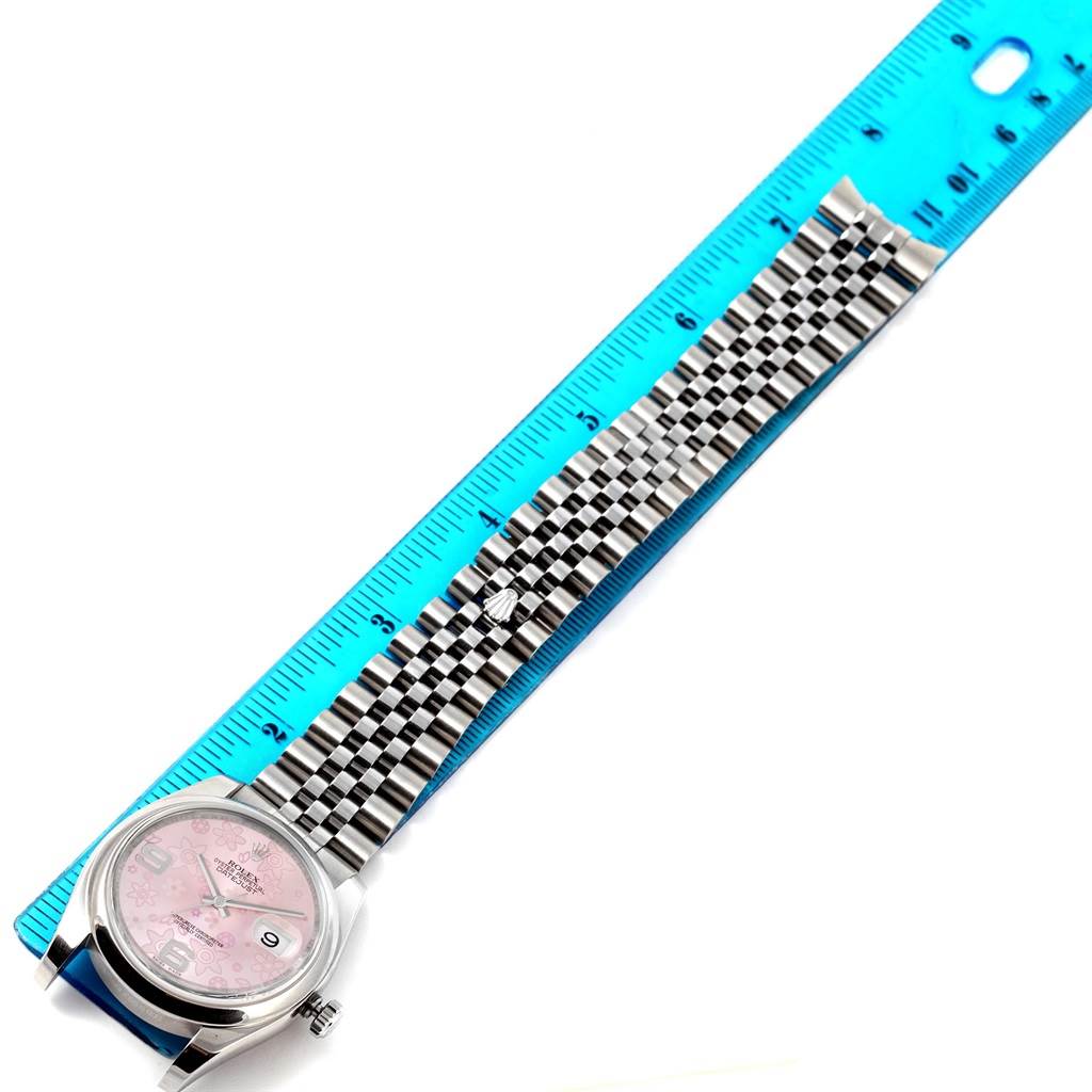 The image shows a Rolex Datejust 116200 Women's Stainless Steel Pink Dial 116200 Women's Stainless Steel Pink Dial watch laid flat with a ruler for measurement, highlighting the watch face and bracelet.