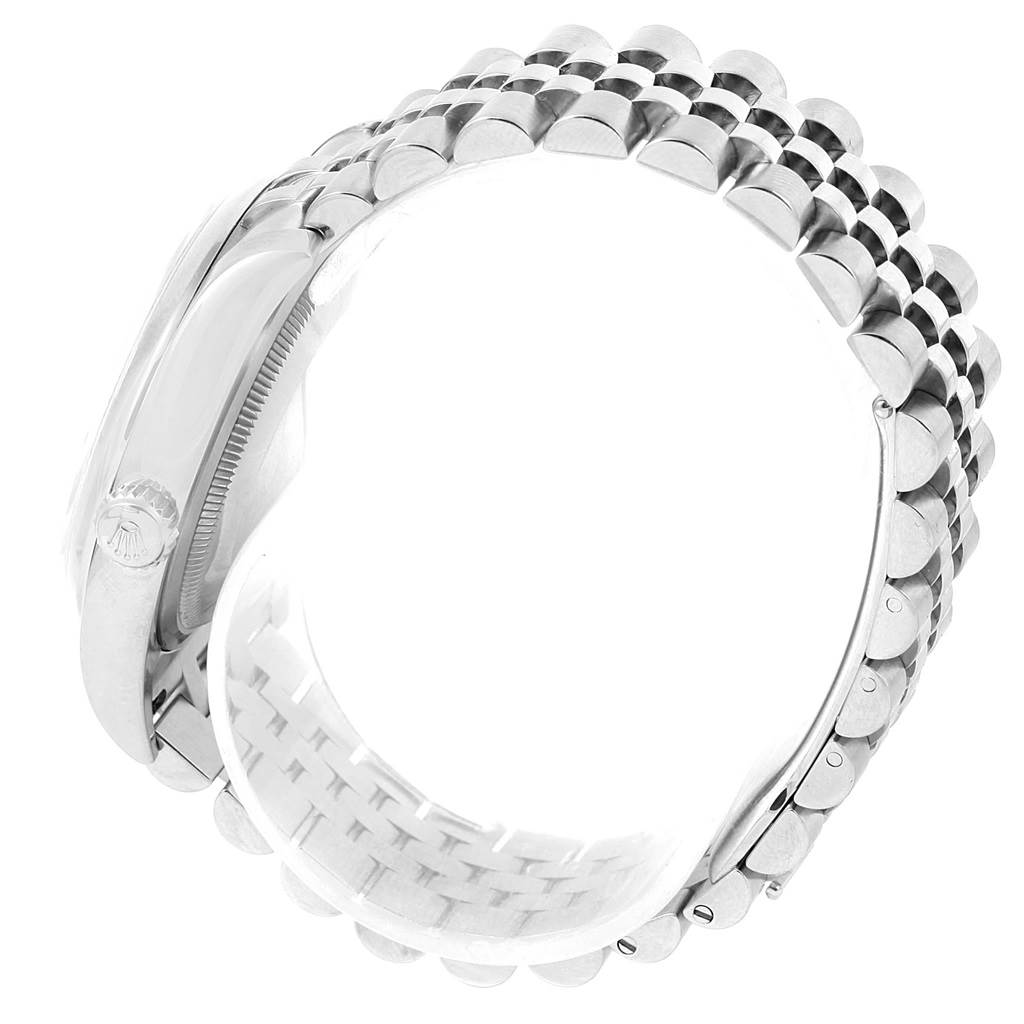 The image shows a side view of the Rolex Datejust 116200 Women's Stainless Steel Pink Dial 116200 Women's Stainless Steel Pink Dial watch's stainless steel bracelet and partially its case.