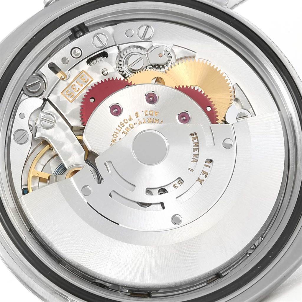 This close-up image shows the intricate mechanism of the Rolex Datejust 116200 Women's Stainless Steel Pink Dial 116200 Women's Stainless Steel Pink Dial watch movement from the rear.