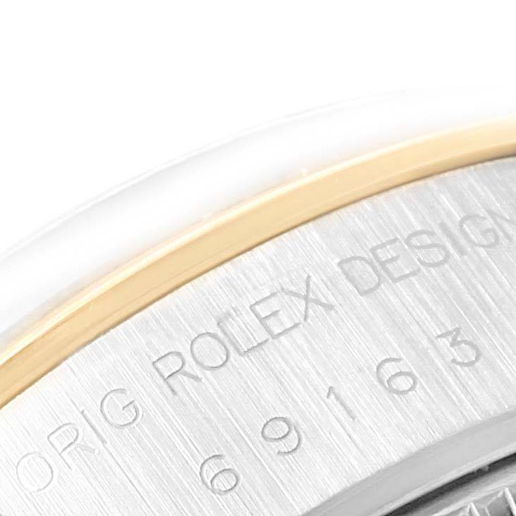 The image shows a close-up angle of the serial number and the bezel edge of a Rolex Datejust 69163 Women's Stainless Steel Beige Dial 69163 Women's Stainless Steel Beige Dial watch.