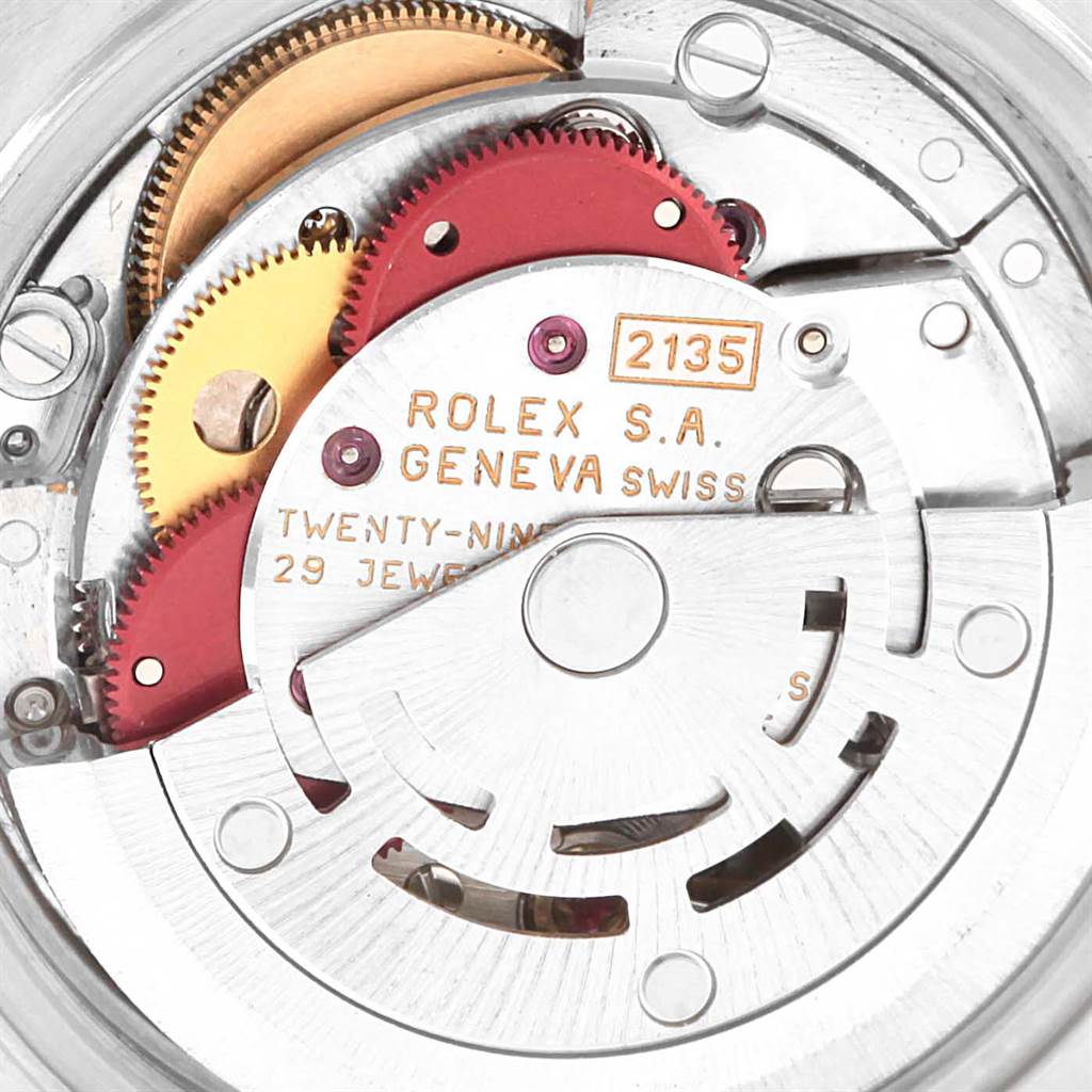 This image shows the internal movement components of the Rolex Datejust 69163 Women's Stainless Steel White Dial 69163 Women's Stainless Steel White Dial model, including gears and inscriptions.