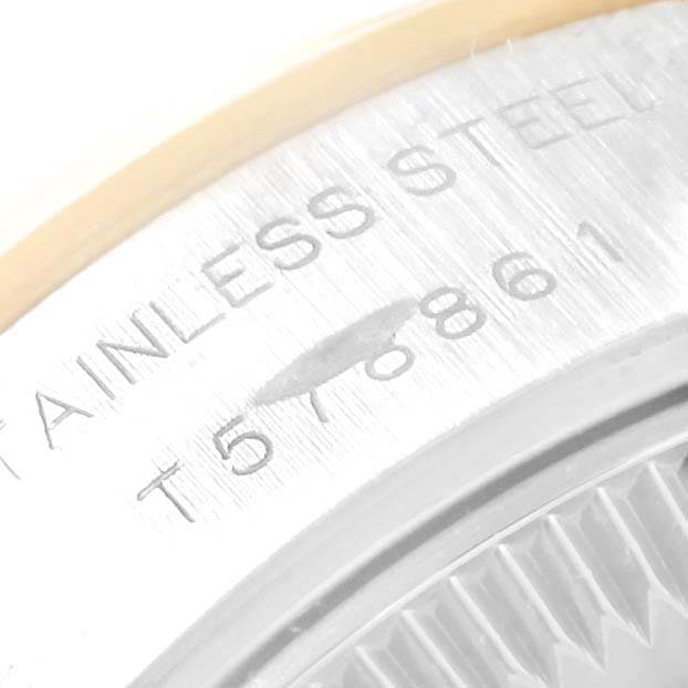 The image shows a macro view of the stainless steel back casing and serial number of a Rolex Datejust 69163 Women's Stainless Steel White Dial 69163 Women's Stainless Steel White Dial watch.