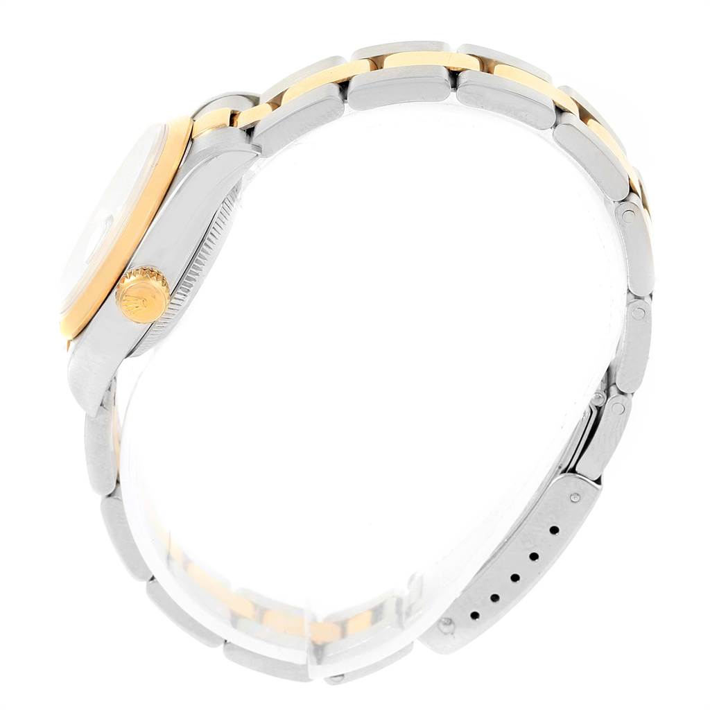 The side view of the Rolex Datejust 69163 Women's Stainless Steel White Dial 69163 Women's Stainless Steel White Dial shows the crown, case, and two-tone bracelet.