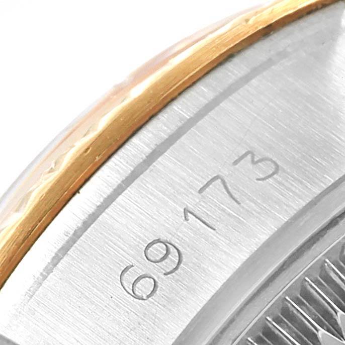 This close-up image shows the engraved model number "69173" on the side of a Rolex Datejust 69173 Women's Stainless Steel White Dial 69173 Women's Stainless Steel White Dial watch case.