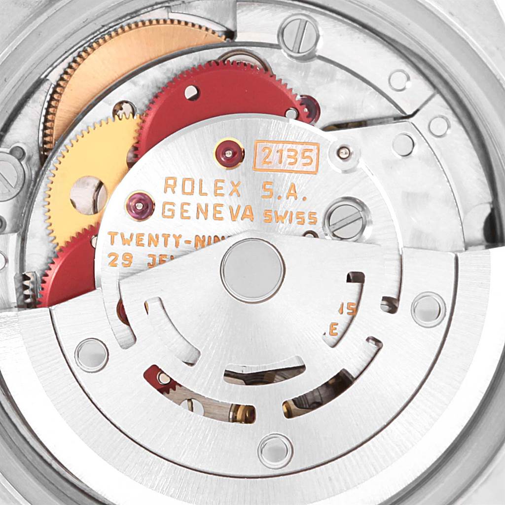 The image shows the internal mechanism and movement of the Rolex Datejust 69173 Women's Stainless Steel White Dial 69173 Women's Stainless Steel White Dial watch, highlighting gears and engravings.