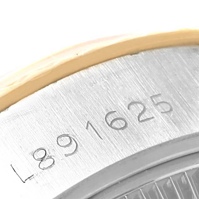 The image shows a close-up of the serial number engraving on the case of a Rolex Datejust 69173 Women's Stainless Steel White Dial 69173 Women's Stainless Steel White Dial watch.