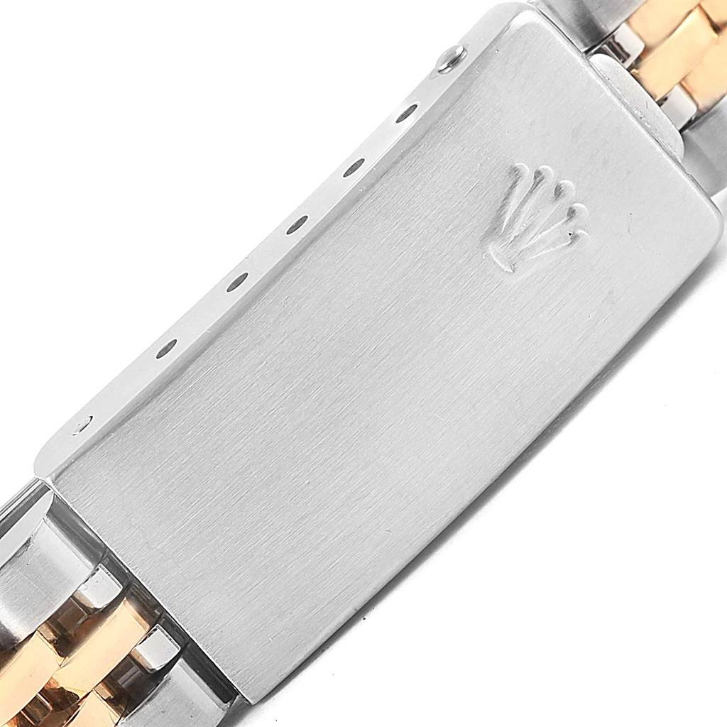 This image shows a close-up of the clasp from the Rolex Datejust 69173 Women's Stainless Steel White Dial 69173 Women's Stainless Steel White Dial watch, featuring the iconic crown logo.