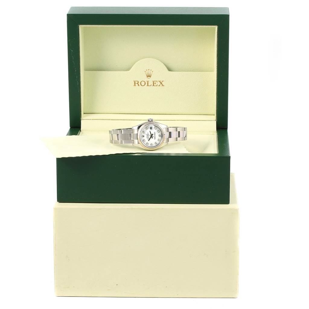 The Rolex Datejust 179174 Women's Stainless Steel White Dial 179174 Women's Stainless Steel White Dial watch is shown from a front angle, resting in its green and cream presentation box.