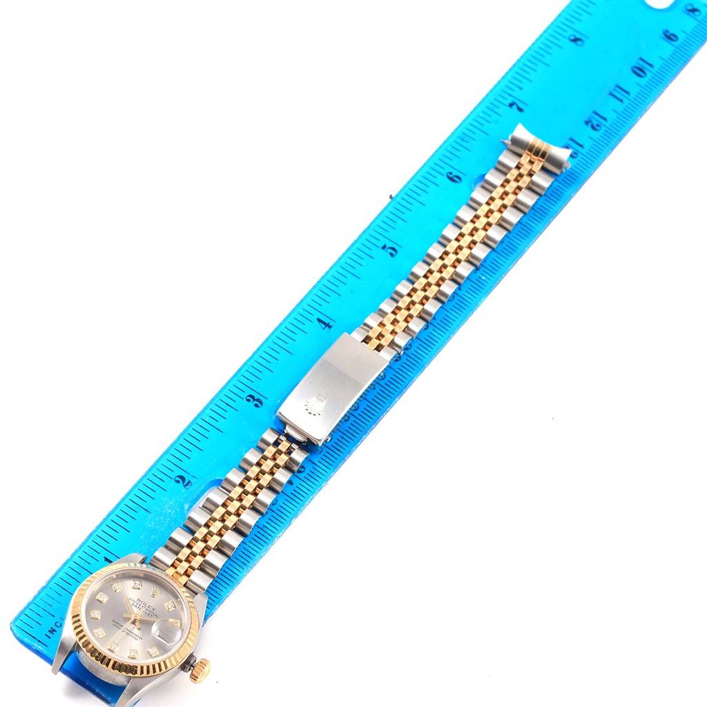 The image shows a Rolex Datejust 79173 Women's Stainless Steel Silver Dial 79173 Women's Stainless Steel Silver Dial watch with a ruler, displaying the face and full length of the band.