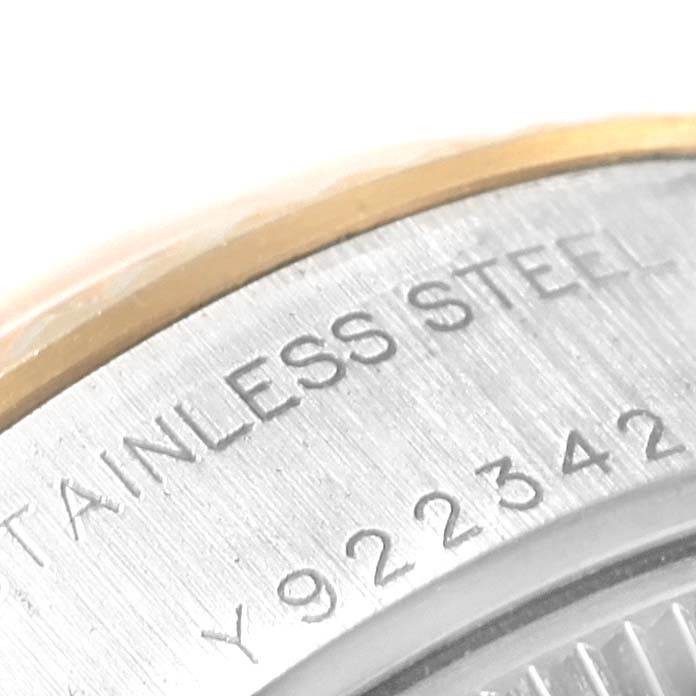 This is a close-up of the back casing of a Rolex Datejust 79173 Women's Stainless Steel Silver Dial 79173 Women's Stainless Steel Silver Dial, showing the stainless steel material and a partial serial number.