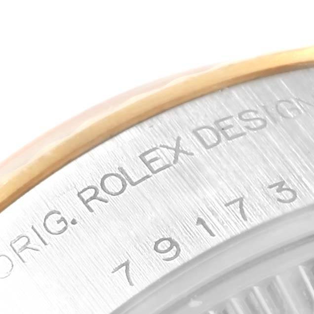 This image shows a close-up angle of the Rolex Datejust 79173 Women's Stainless Steel Silver Dial 79173 Women's Stainless Steel Silver Dial model focusing on the engraved bezel and outer casing.