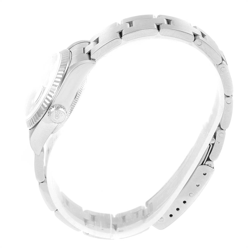 This side view of the Rolex Datejust 79174 Women's Stainless Steel Mother of Pearl Dial 79174 Women's Stainless Steel Mother of Pearl Dial watch highlights the crown, bezel, and part of the bracelet.