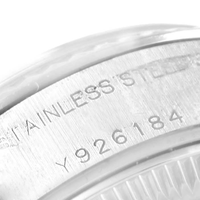 This image shows a close-up of the engravings on the side of a Rolex Datejust 79174 Women's Stainless Steel Mother of Pearl Dial 79174 Women's Stainless Steel Mother of Pearl Dial model watch case.