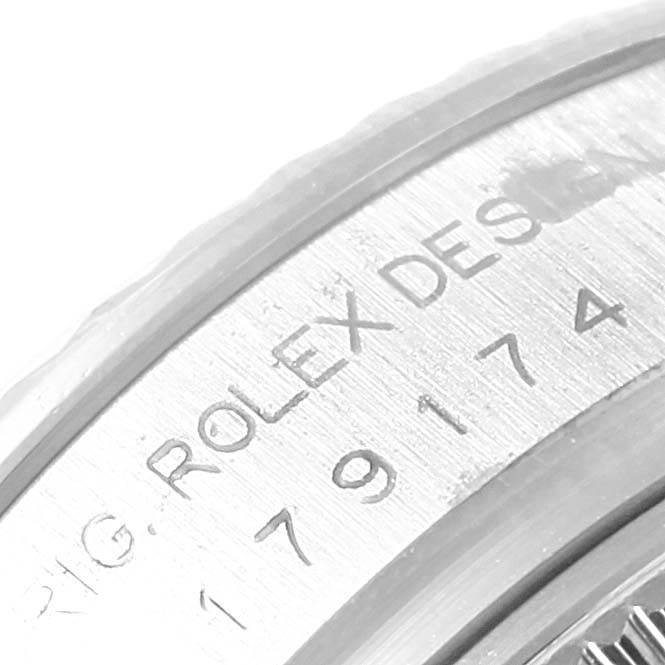 This close-up image of the Rolex Datejust 179174 Women's Stainless Steel Silver Dial 179174 Women's Stainless Steel Silver Dial watch displays the engraving on the side of the case.