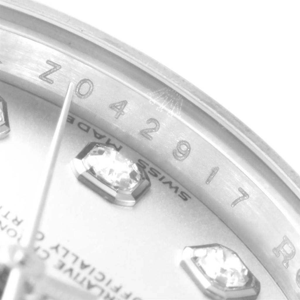 The image shows a close-up view of the dial and bezel of a Rolex Datejust 179174 Women's Stainless Steel Silver Dial 179174 Women's Stainless Steel Silver Dial watch, highlighting the serial number and diamond hour markers.