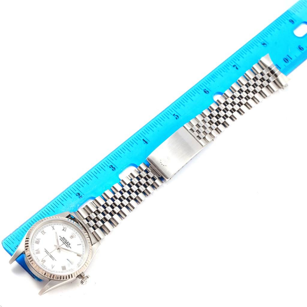 This image shows a Rolex Datejust 16234 Men's Stainless Steel White Dial 16234 Men's Stainless Steel White Dial watch from a top-down angle, including the face and the entire stainless steel bracelet.