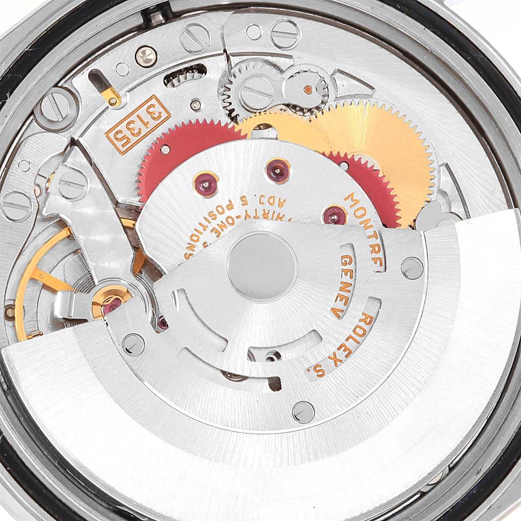 This image shows the intricate internal mechanism of the Rolex Datejust 16234 Men's Stainless Steel White Dial 16234 Men's Stainless Steel White Dial watch from a top-down angle, highlighting its gears and movement components.