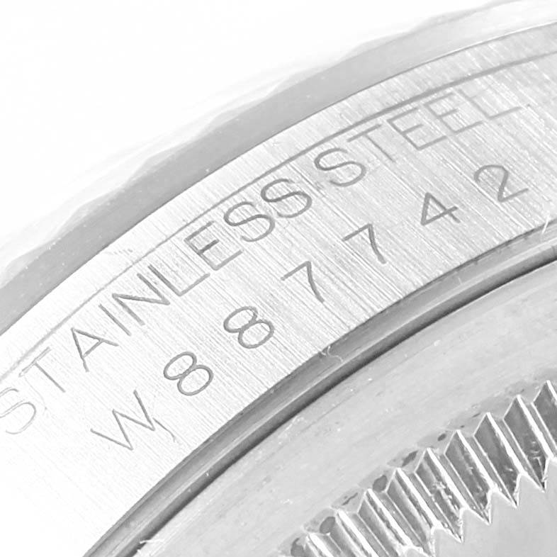 This image shows a close-up of the stainless steel casing and engraved serial number on a Rolex Datejust 16234 Men's Stainless Steel White Dial 16234 Men's Stainless Steel White Dial watch.
