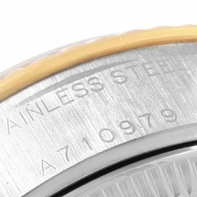 This is a close-up angle focusing on the stainless steel casing and serial number of the Rolex Datejust 79173 Women's Stainless Steel Black Dial 79173 Women's Stainless Steel Black Dial watch.