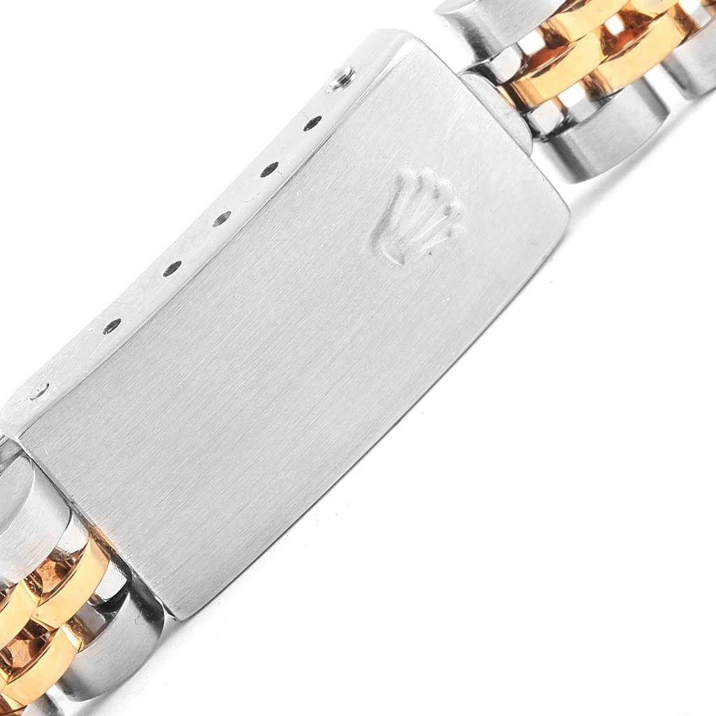 The image shows the clasp of a Rolex Datejust 79173 Women's Stainless Steel Black Dial 79173 Women's Stainless Steel Black Dial watch, highlighting its logo and two-tone metal bracelet.
