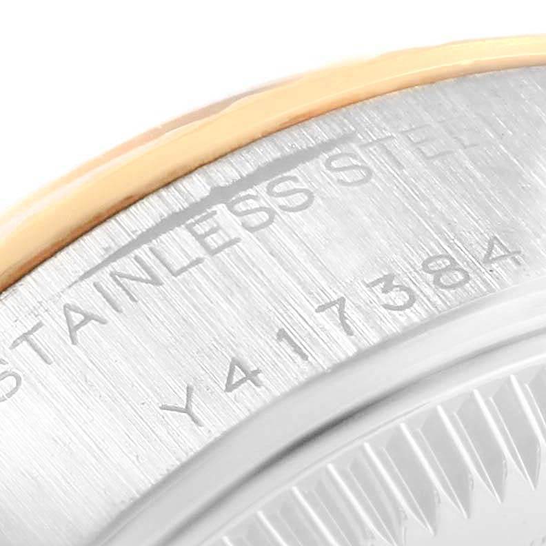 The image shows a close-up view of the case back and serial number on a Rolex Datejust 79173 Women's Stainless Steel Champagne Dial 79173 Women's Stainless Steel Champagne Dial watch.
