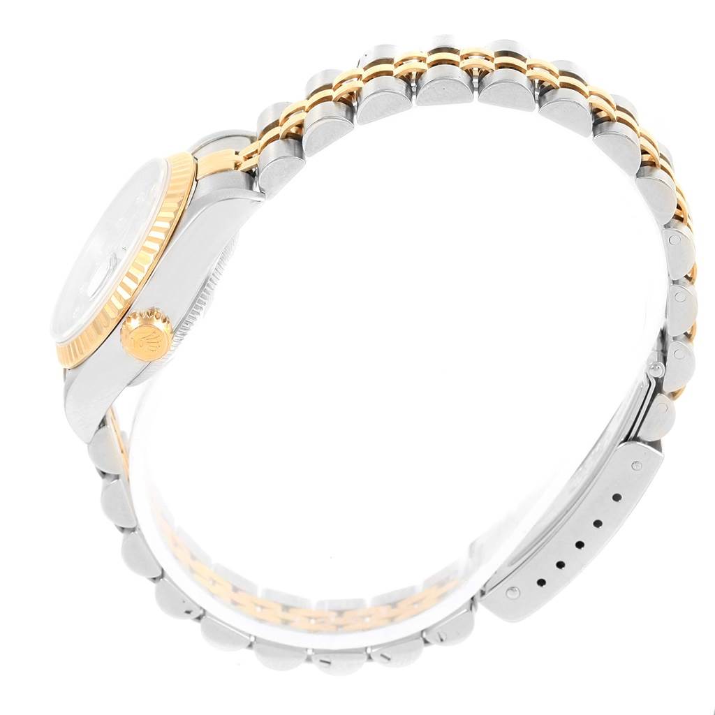 The image shows a side view of a Rolex Datejust 79173 Women's Stainless Steel Champagne Dial 79173 Women's Stainless Steel Champagne Dial, highlighting its case, crown, and two-tone bracelet.