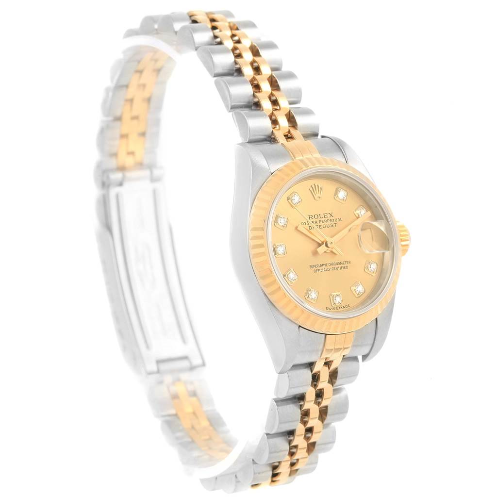 The Rolex Datejust 79173 Women's Stainless Steel Champagne Dial 79173 Women's Stainless Steel Champagne Dial watch is shown at a slight side angle, highlighting its two-tone band, gold face, and diamond hour markers.