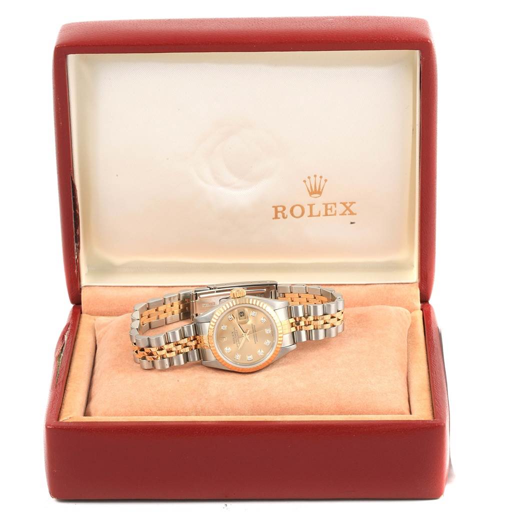 The Rolex Datejust 79173 Women's Stainless Steel Champagne Dial 79173 Women's Stainless Steel Champagne Dial watch is displayed face-up in its open box, showcasing the dial and band.