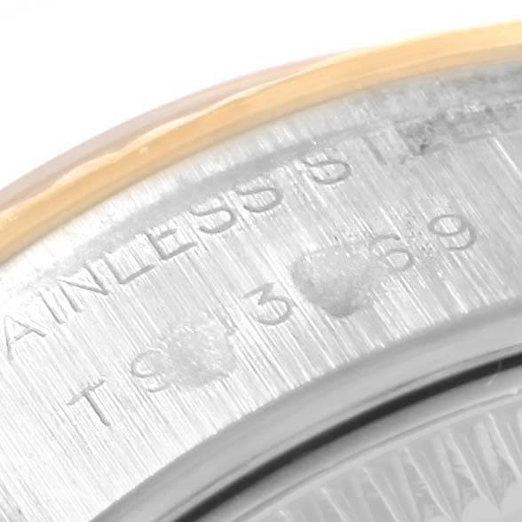 The image shows a close-up view of the stainless steel casing edge of a Rolex Datejust 69173 Women's Stainless Steel Black Dial 69173 Women's Stainless Steel Black Dial watch, highlighting engraved details.