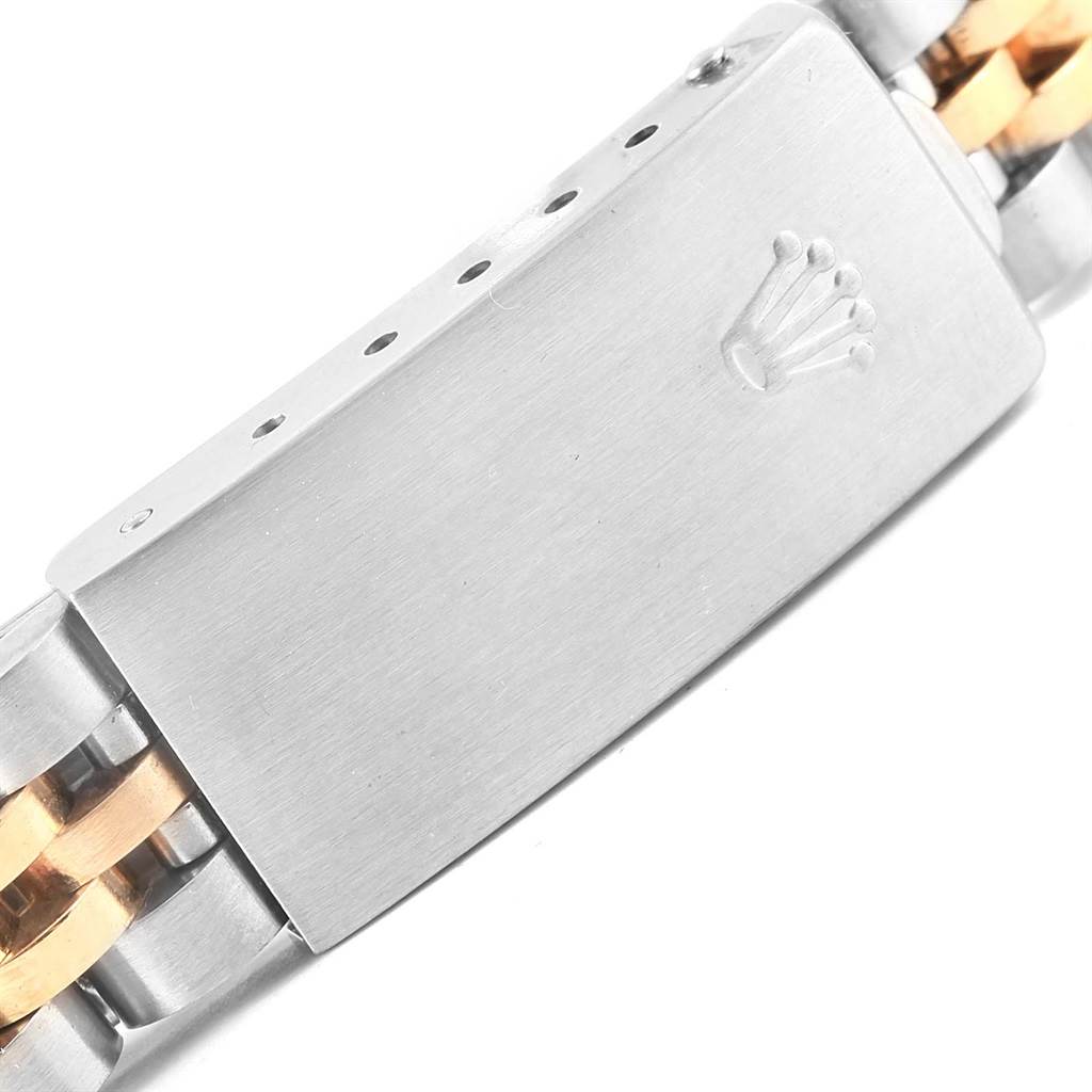 The image shows the clasp of a Rolex Datejust 69173 Women's Stainless Steel Black Dial 69173 Women's Stainless Steel Black Dial watch, featuring a combination of silver and gold links.