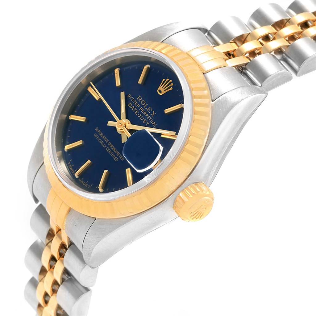This image shows a close-up angled view of a Rolex Datejust 69173 Women's Stainless Steel Blue Dial 69173 Women's Stainless Steel Blue Dial watch, highlighting its blue face, gold bezel, and two-tone bracelet.