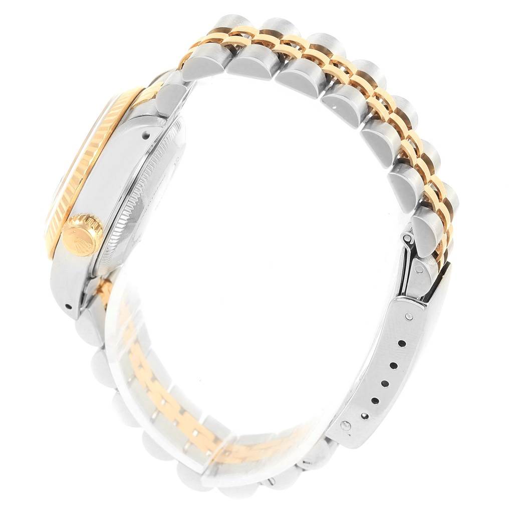 This is a side view of a Rolex Datejust 69173 Women's Stainless Steel Blue Dial 69173 Women's Stainless Steel Blue Dial watch, showing the crown, case, and Jubilee bracelet.