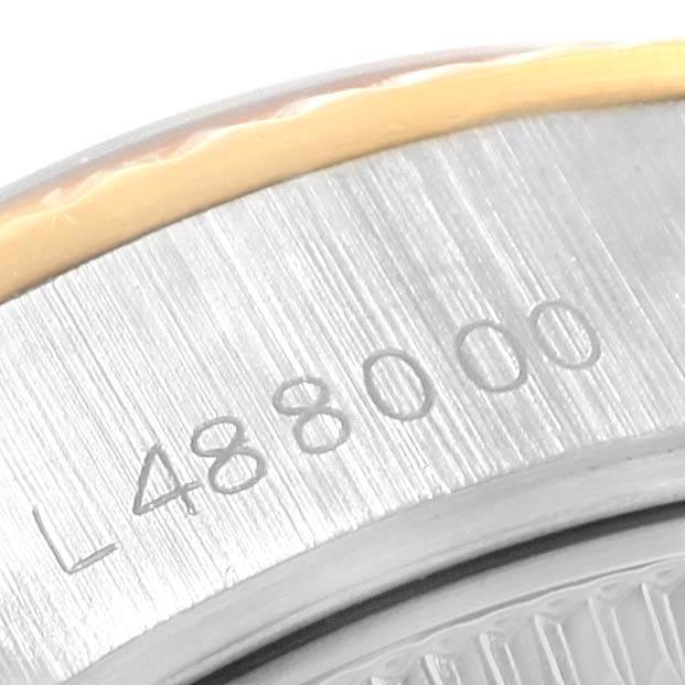 The image shows a close-up of the serial number on the casing of a Rolex Datejust 69173 Women's Stainless Steel Blue Dial 69173 Women's Stainless Steel Blue Dial watch.