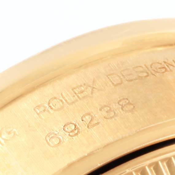 This close-up angle shows the model number engraving (69238) on the case of a Rolex Datejust 69238 Women's Yellow Gold Silver Dial 69238 Women's Yellow Gold Silver Dial watch.