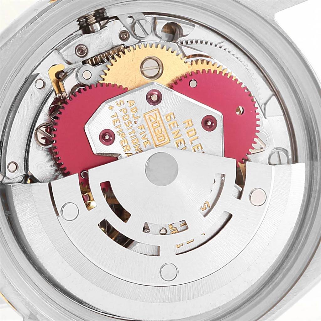 This image shows a close-up of the internal movement parts of a Rolex Datejust 6917 Women's Stainless Steel Champagne Dial 6917 Women's Stainless Steel Champagne Dial watch, highlighting the gears and rotor.