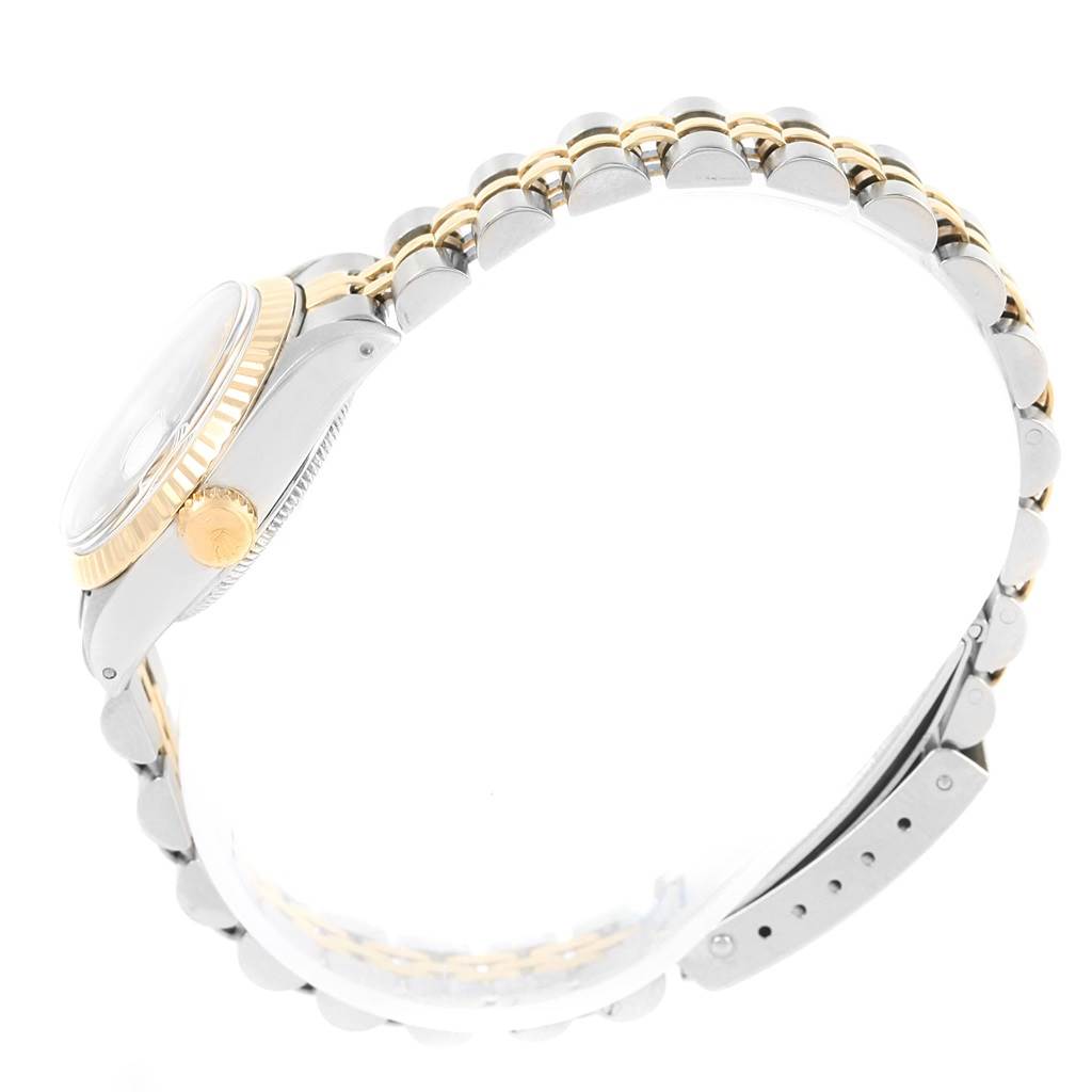 This is a side view of the Rolex Datejust 6917 Women's Stainless Steel Champagne Dial 6917 Women's Stainless Steel Champagne Dial watch, showing the case, crown, and two-tone bracelet.