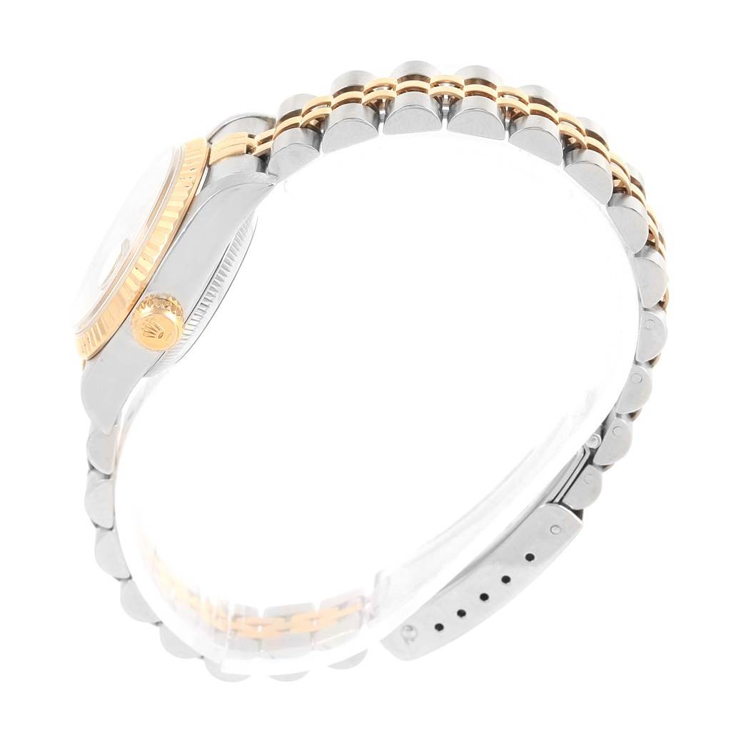 The side view of the Rolex Datejust 69173 Women's Stainless Steel Champagne Dial 69173 Women's Stainless Steel Champagne Dial shows the case, crown, and part of the bracelet.