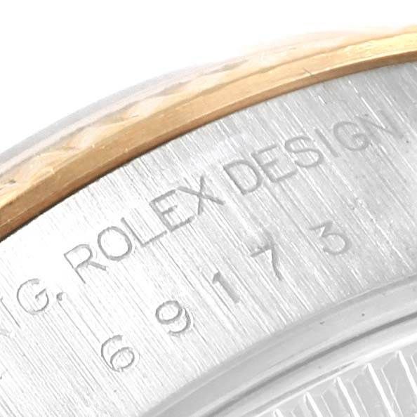 This close-up image shows the engraved side of the casing for a Rolex Datejust 69173 Women's Stainless Steel Champagne Dial 69173 Women's Stainless Steel Champagne Dial model watch.