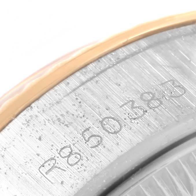 The image shows a close-up of the Rolex Datejust 69173 Women's Stainless Steel Beige Dial 69173 Women's Stainless Steel Beige Dial watch case's inner bezel with engraved serial numbers.