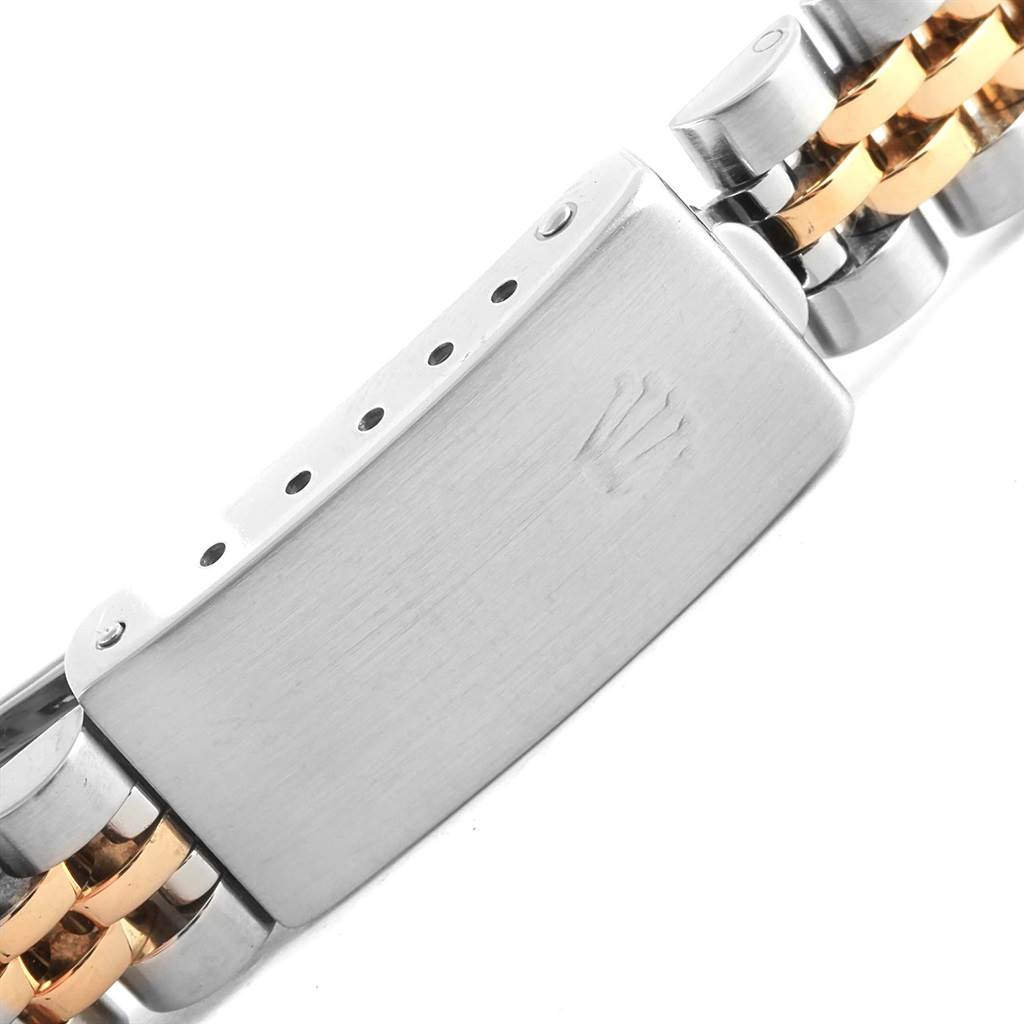 This image shows the clasp of a Rolex Datejust 69173 Women's Stainless Steel Beige Dial 69173 Women's Stainless Steel Beige Dial model watch bracelet, focusing on the crown logo and link details.