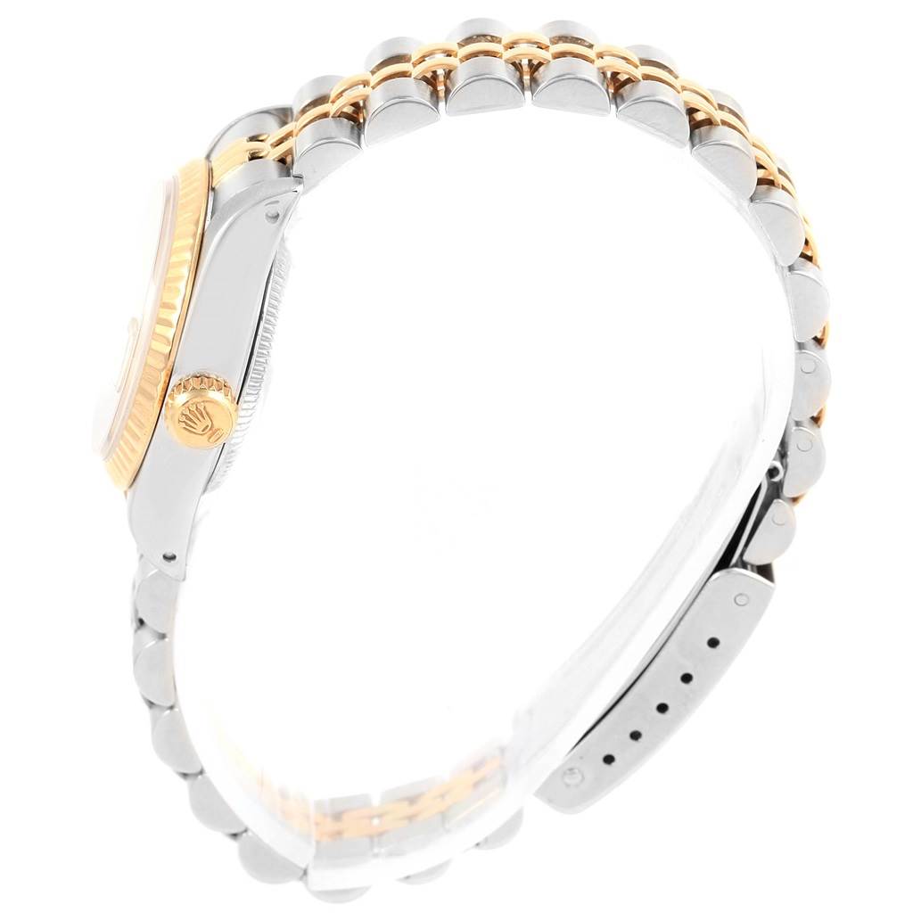 The image shows a side view of the Rolex Datejust 69173 Women's Stainless Steel Beige Dial 69173 Women's Stainless Steel Beige Dial watch, highlighting the crown, case, and part of the bracelet.