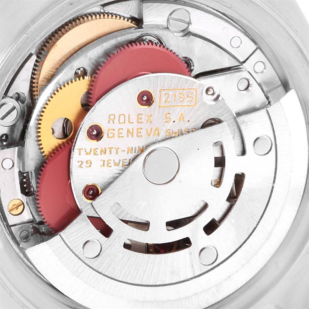This image shows the intricate inner mechanism of a Rolex Datejust 69173 Women's Stainless Steel White Dial 69173 Women's Stainless Steel White Dial watch, highlighting its gears and detailed engravings.