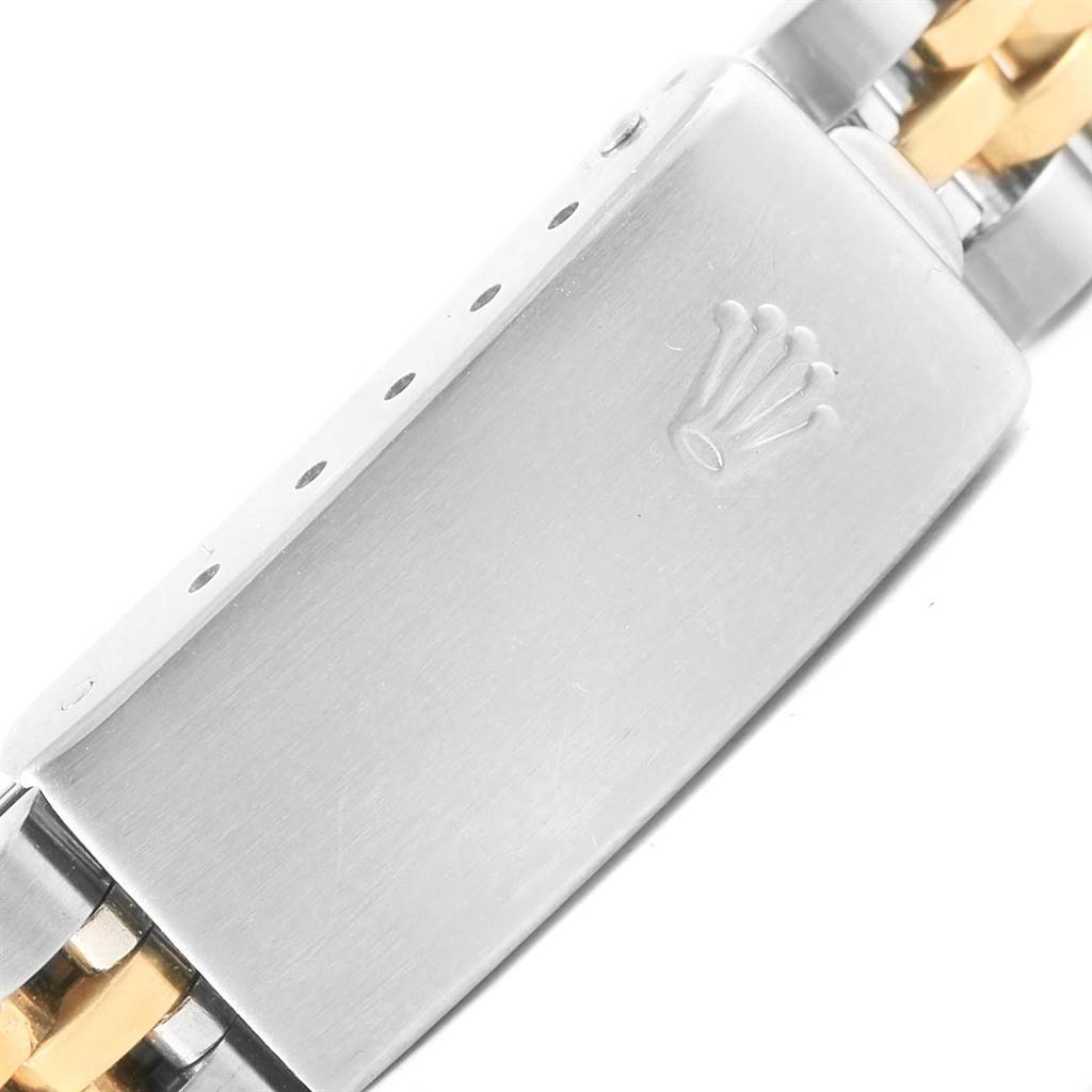 This close-up image shows the clasp of a Rolex Datejust 69173 Women's Stainless Steel Champagne Dial 69173 Women's Stainless Steel Champagne Dial watch, with the Rolex crown logo visible.