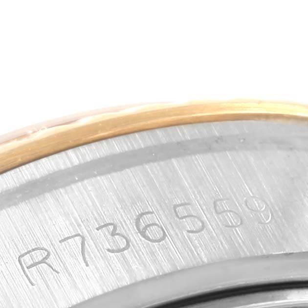 This image shows a close-up of the serial number engraved on the case back or inner bezel of a Rolex Datejust 69173 Women's Stainless Steel Champagne Dial 69173 Women's Stainless Steel Champagne Dial watch.