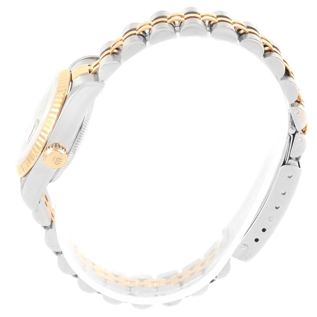 This image shows a side view of a Rolex Datejust 79173 Women's Steel and Gold (two tone) Black Dial 79173 Women's Steel and Gold (two tone) Black Dial watch, highlighting its crown, bezel, and two-tone bracelet.