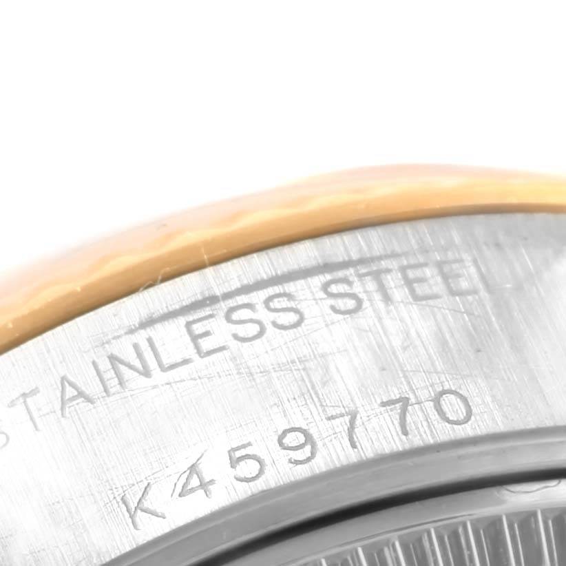 This close-up angle shows the stainless steel case back of a Rolex Datejust 79173 Women's Steel and Gold (two tone) Black Dial 79173 Women's Steel and Gold (two tone) Black Dial watch with serial number engraving.